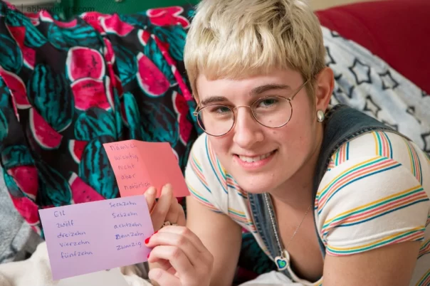 Amateur with short blonde hair and glasses Maely gets naked