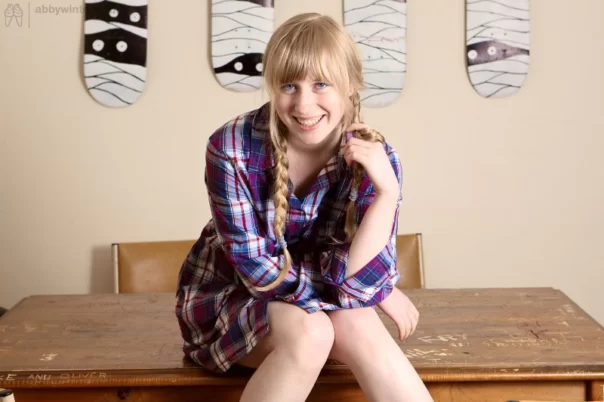 Blonde amateur with pigtails Satine shows how wet her hairy pussy is